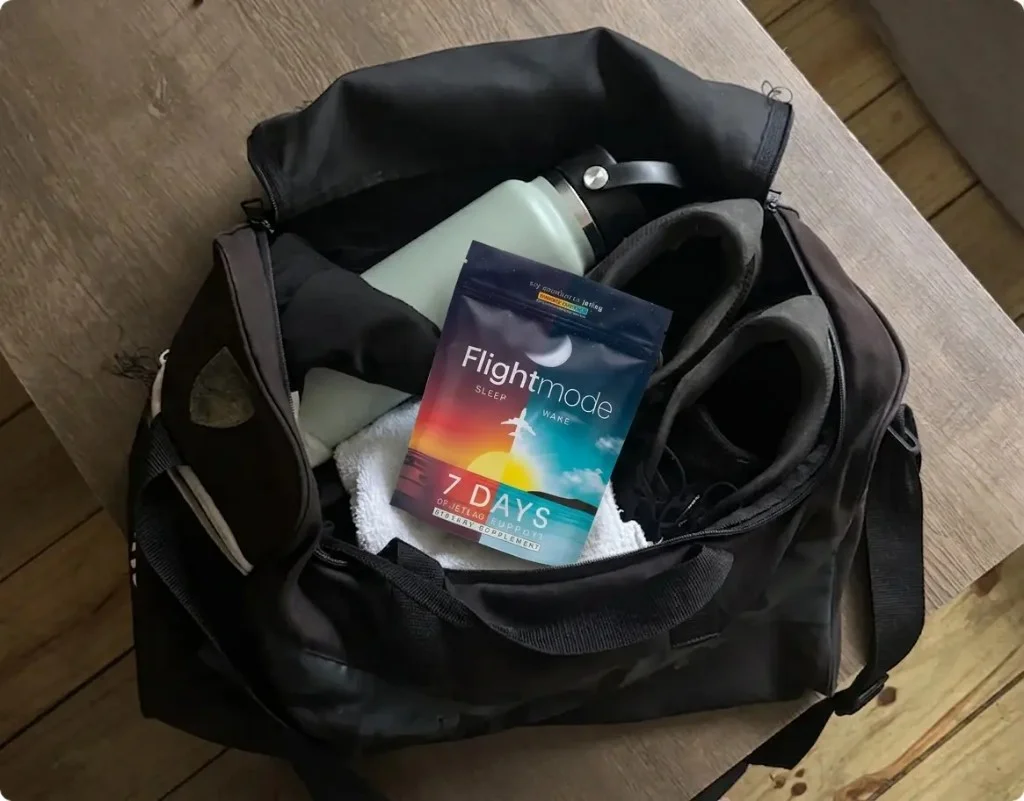 Flightmode daily pack packed in a carry-on duffel bag